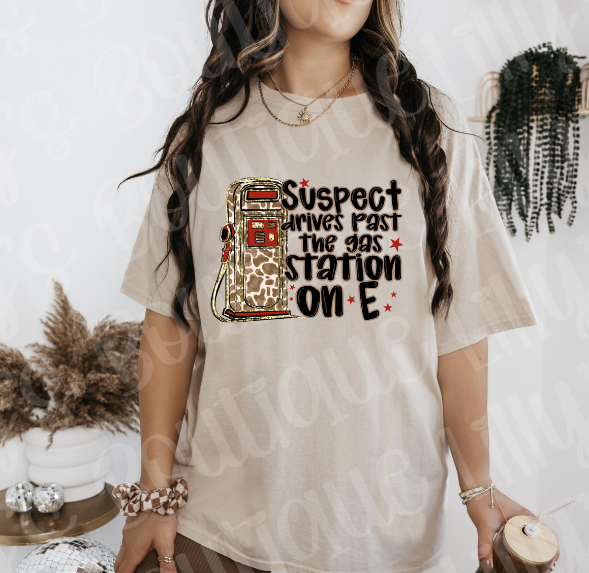 Suspect drives past the gas station on E (tan)