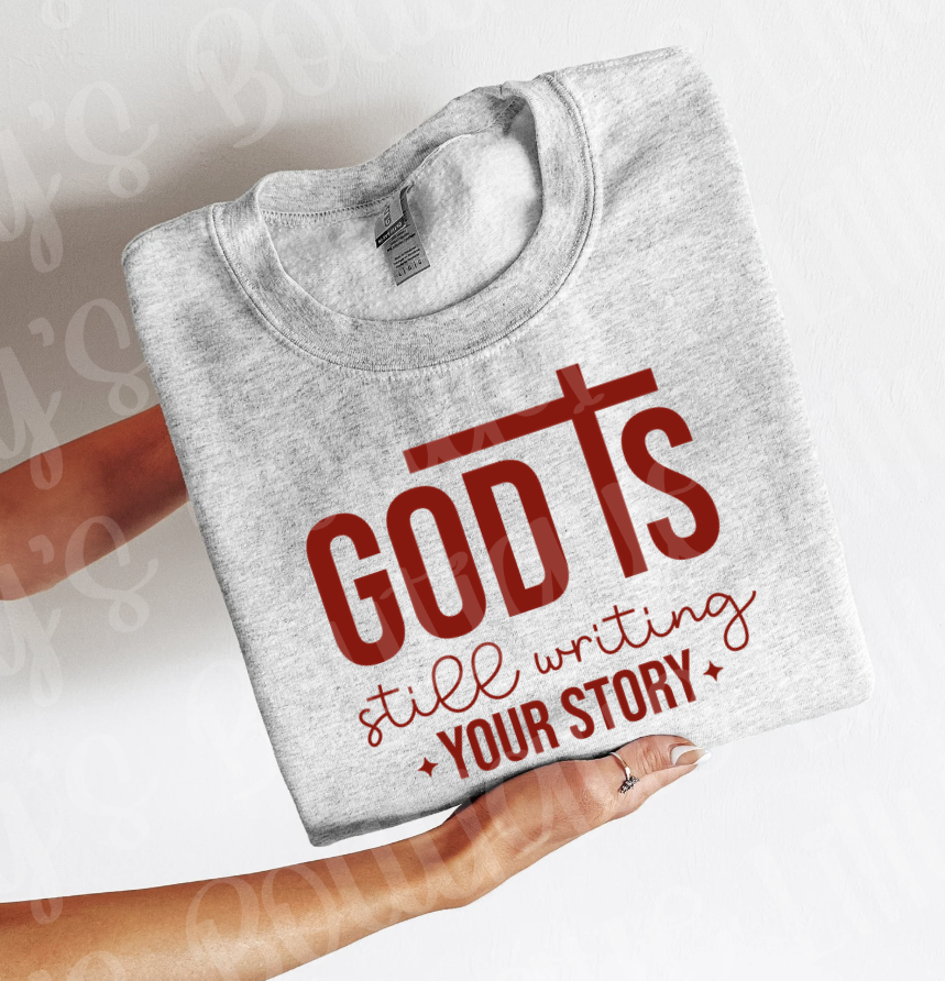 God is still writing your story (ash sweatshirt)
