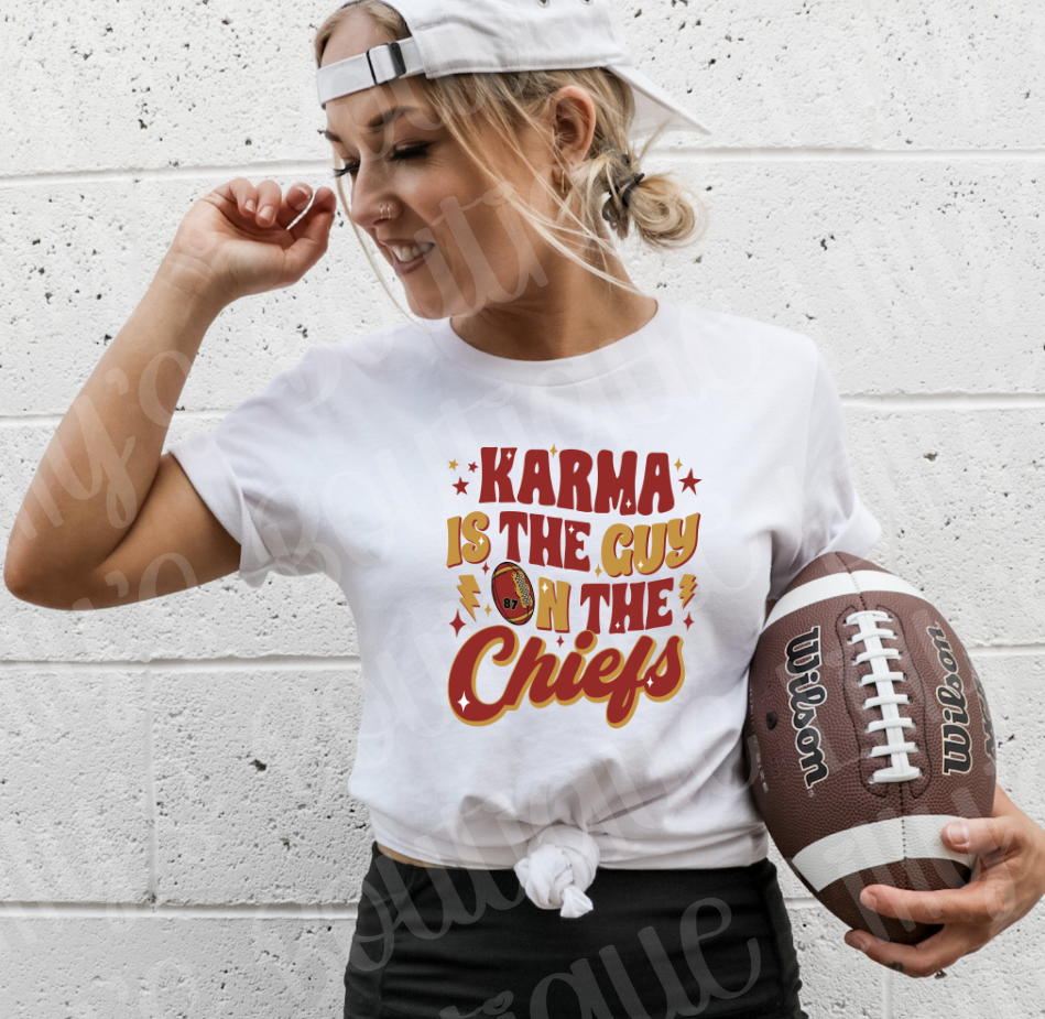 karma is the guy on the chiefs tee