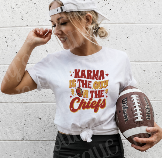 karma is the guy on the chiefs tee