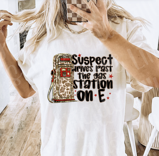 Suspect drives past the gas station on E (white)