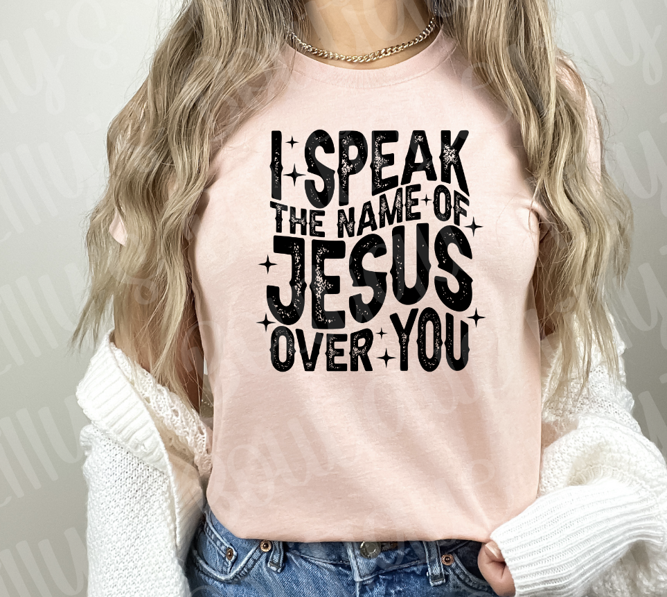 I speak the name of Jesus over you tee